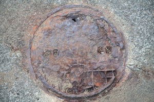 corroded manhole
